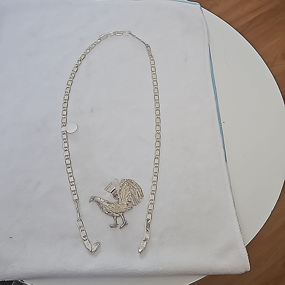 Valentino style silver chain and beautiful rooster pendant..
